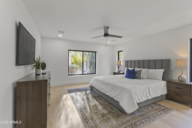 bedroom featuring light hardwood / wood-style floors and ceiling fan