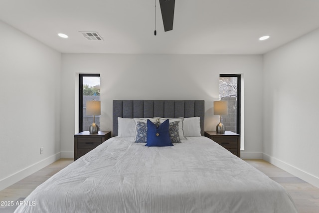 bedroom featuring ceiling fan and light hardwood / wood-style flooring