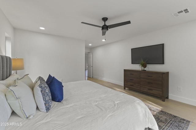 bedroom featuring light hardwood / wood-style flooring and ceiling fan