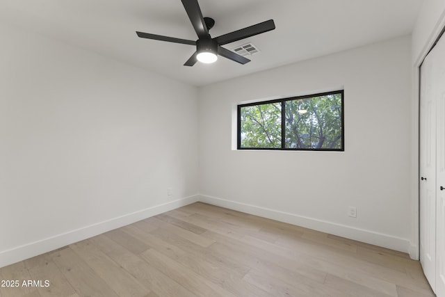 unfurnished room featuring ceiling fan and light wood-type flooring