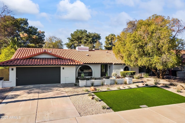 mediterranean / spanish-style house with a front yard