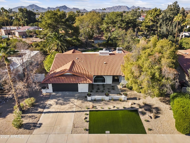 birds eye view of property featuring a mountain view