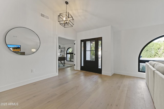 foyer featuring a notable chandelier and light wood-type flooring