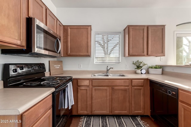 kitchen featuring black appliances and sink