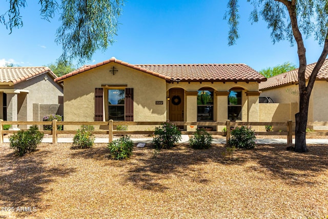 4495 E Woodside Way, Gilbert, AZ 85297 - mediterranean / spanish house featuring a tiled roof, fence private yard, and stucco siding