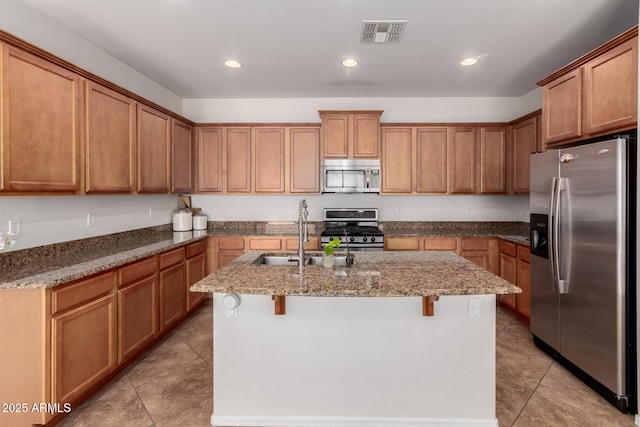 4495 E Woodside Way, Gilbert, AZ 85297 - kitchen with appliances with stainless steel finishes, a sink, visible vents, and light tile patterned floors