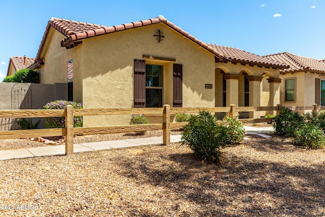 4495 E Woodside Way, Gilbert, AZ 85297 - mediterranean / spanish house with stucco siding, a tile roof, and a fenced front yard