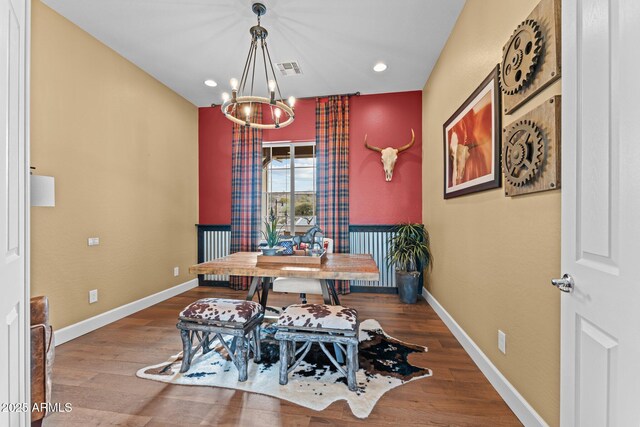 dining space featuring visible vents, wood finished floors, recessed lighting, baseboards, and a chandelier