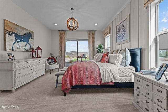 bedroom with an inviting chandelier, access to outside, recessed lighting, and light carpet