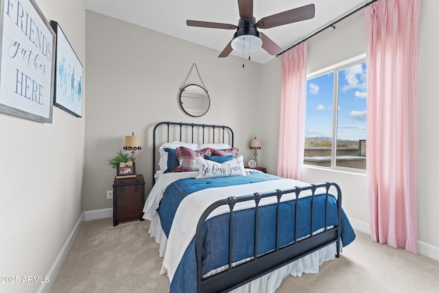 bedroom featuring a ceiling fan, baseboards, and carpet floors