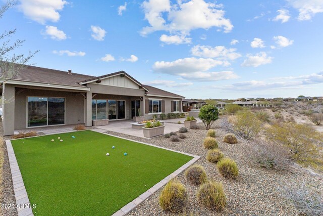 rear view of house with a patio area