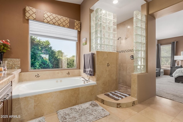 bathroom featuring ensuite bathroom, a bath, tile patterned flooring, and a walk in shower