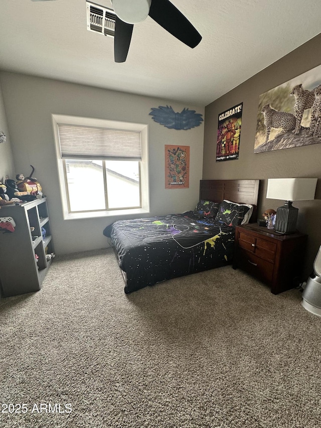 carpeted bedroom featuring ceiling fan