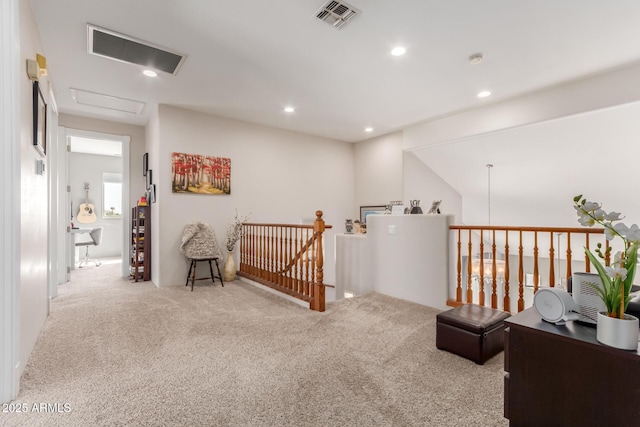 sitting room featuring recessed lighting, visible vents, an upstairs landing, and carpet flooring