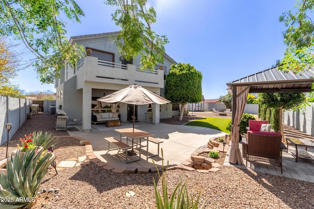 exterior space featuring a gazebo and a fenced backyard