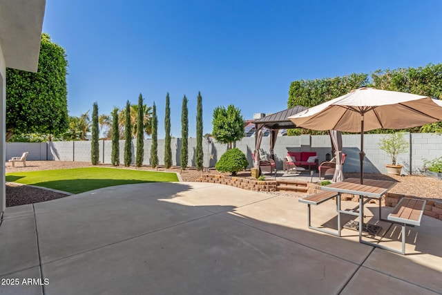 view of patio featuring outdoor lounge area and a fenced backyard