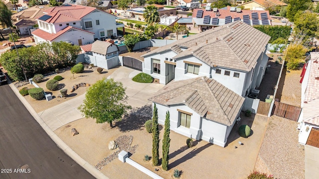 birds eye view of property with a residential view