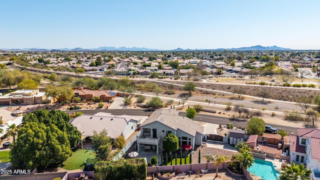 birds eye view of property with a mountain view and a residential view