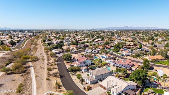 birds eye view of property with a mountain view and a residential view