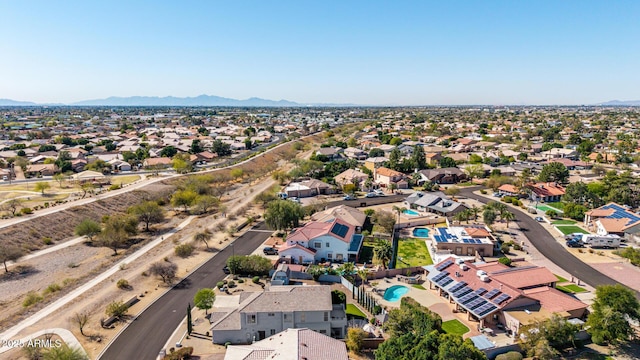 birds eye view of property featuring a mountain view and a residential view