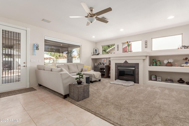 living room with recessed lighting, visible vents, ceiling fan, and a fireplace