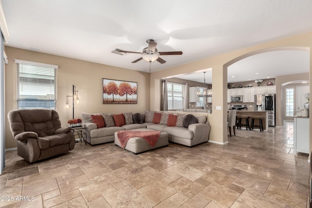 living room featuring ceiling fan