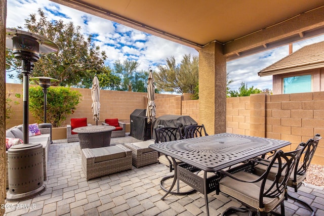 view of patio / terrace with a fire pit