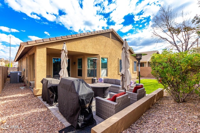 back of house featuring an outdoor hangout area and central air condition unit