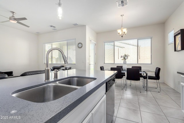 20496 W Valley View Dr, Buckeye, AZ 85396 - kitchen with a sink, dishwasher, decorative light fixtures, and a chandelier