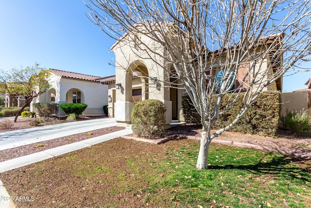 20496 W Valley View Dr, Buckeye, AZ 85396 - view of front facade featuring stucco siding, a tile roof, and driveway