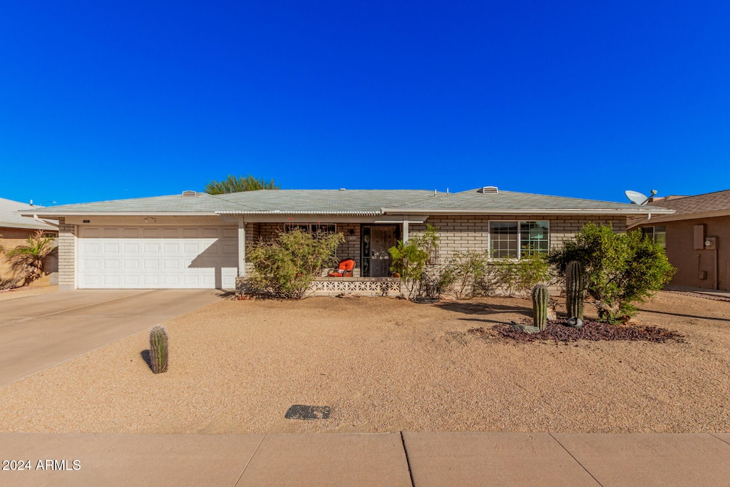 single story home with a garage