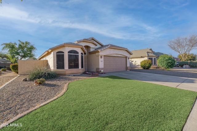 view of front of home featuring stucco siding, a garage, concrete driveway, and a front yard