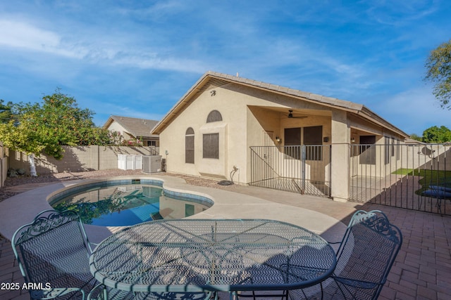 view of pool with central AC, a patio area, a fenced in pool, and a fenced backyard