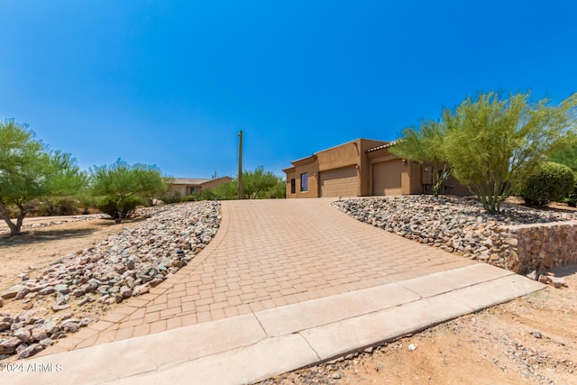 southwest-style home featuring a garage