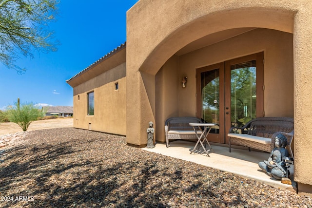 rear view of property featuring a patio area