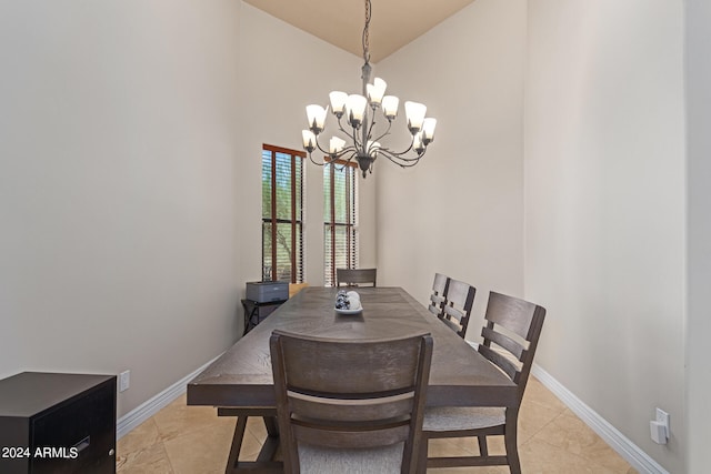 dining room with high vaulted ceiling and an inviting chandelier