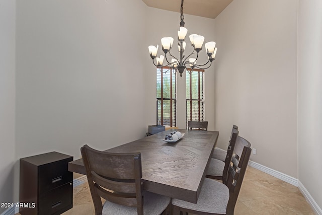 dining area featuring an inviting chandelier and light tile patterned floors