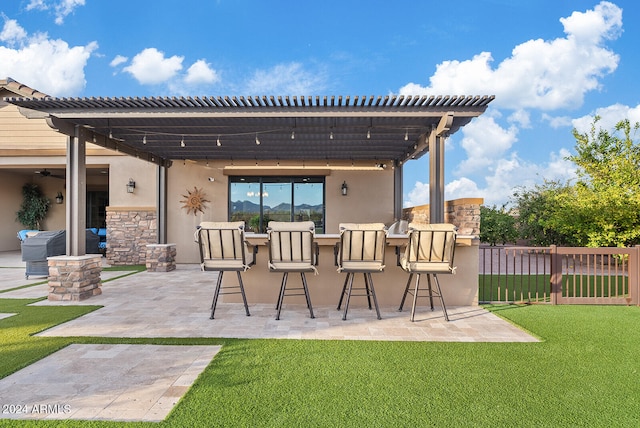 view of patio featuring exterior bar