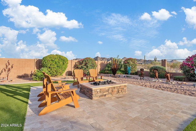 view of patio / terrace featuring an outdoor fire pit