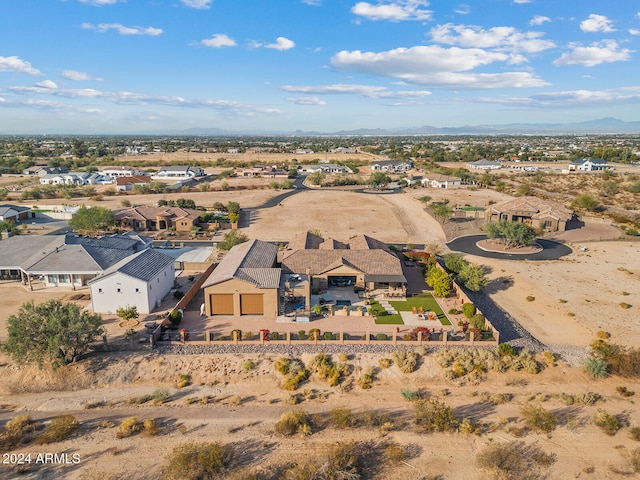 birds eye view of property with a mountain view