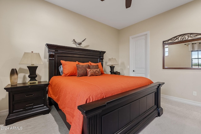 bedroom featuring light carpet and ceiling fan