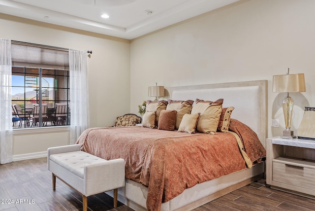 bedroom with hardwood / wood-style floors