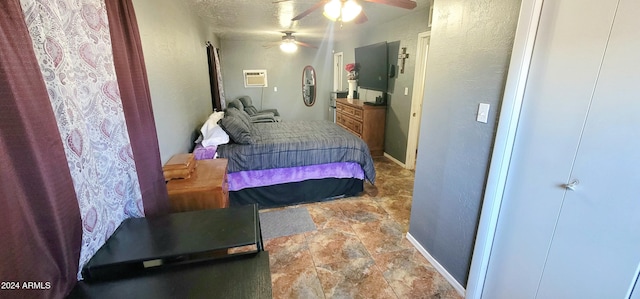 bedroom with ceiling fan and a wall mounted AC