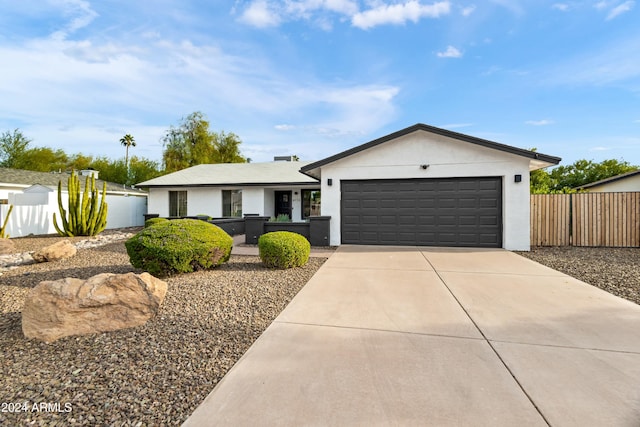 ranch-style home featuring a garage