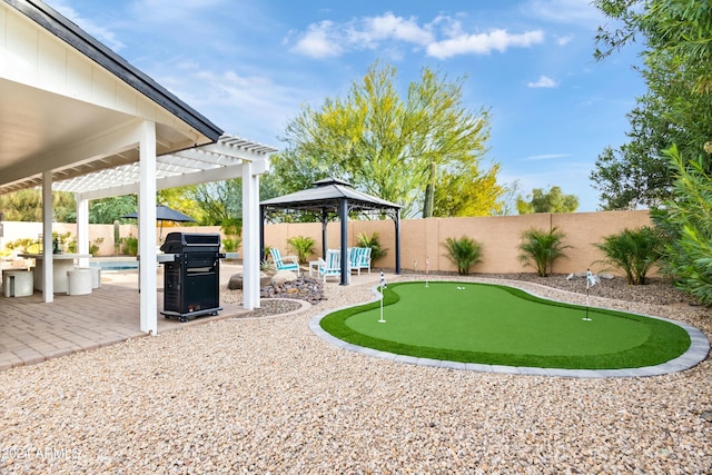 view of yard with a gazebo, a patio area, a pergola, and a fenced in pool