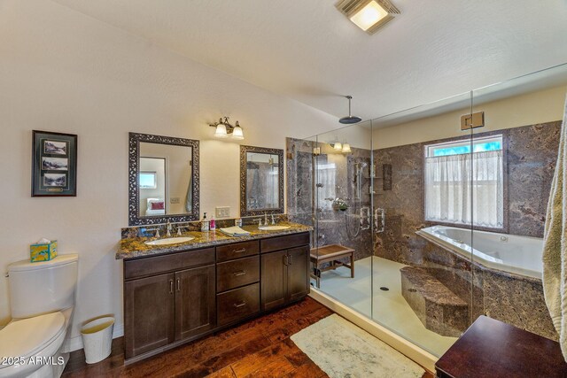 2335 Voyager Cir, Overgaard, AZ 85933 - bathroom with a shower stall, a garden tub, toilet, double vanity, and wood finished floors
