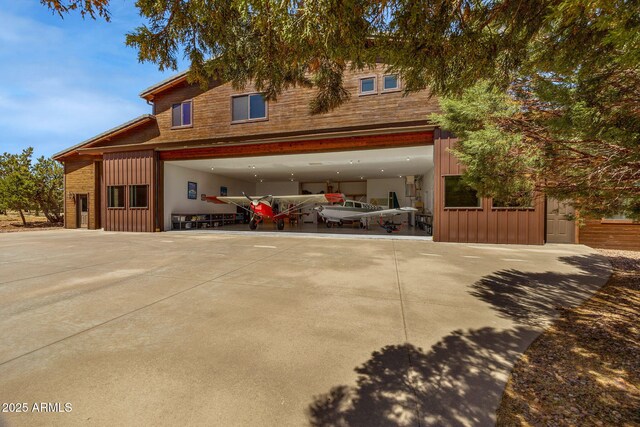 2335 Voyager Cir, Overgaard, AZ 85933 - view of front of home with board and batten siding and concrete driveway