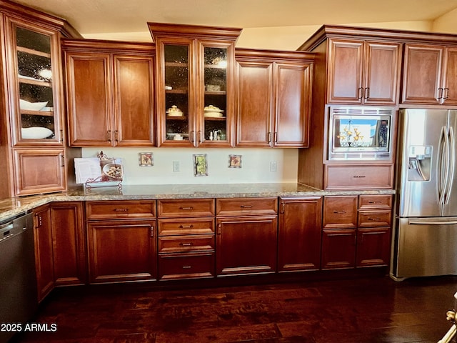2335 Voyager Cir, Overgaard, AZ 85933 - kitchen with stainless steel appliances, light stone countertops, glass insert cabinets, and dark wood-style floors