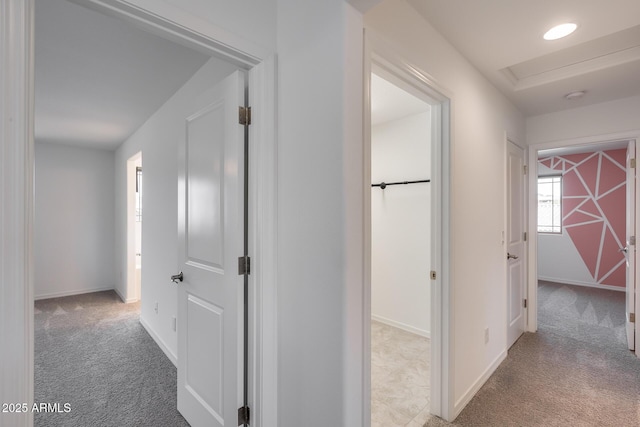 hall featuring recessed lighting, baseboards, and carpet floors