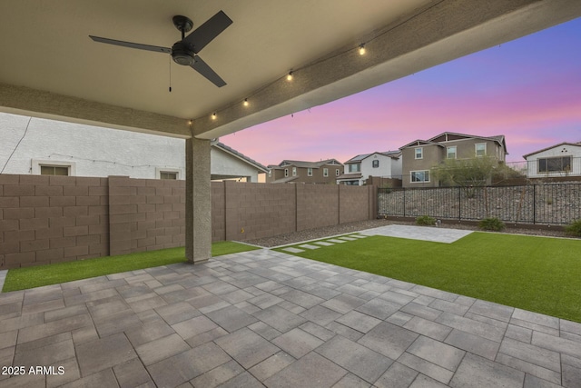 view of patio with a fenced backyard and ceiling fan